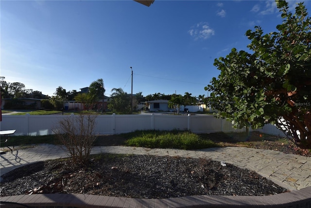 552 Trade Winds Dr, Dunedin, FL 34698 - fenced backyard with a patio