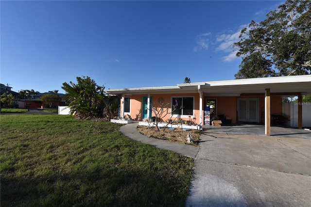 single story home with a front lawn and stucco siding