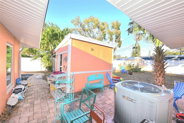 view of patio / terrace with a fenced backyard and central AC unit