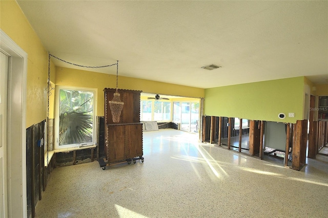 interior space with visible vents and speckled floor