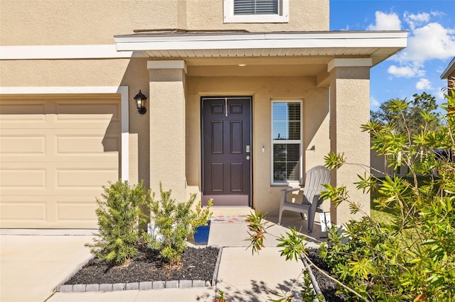 entrance to property featuring a garage