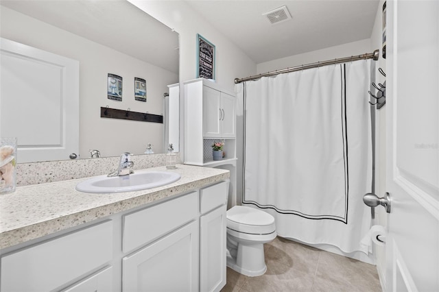 bathroom with curtained shower, tile patterned flooring, vanity, and toilet