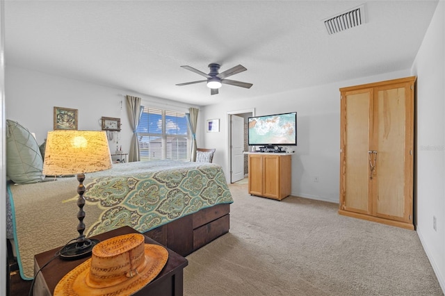 carpeted bedroom with ceiling fan