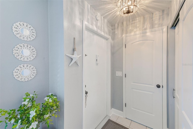 interior space with light tile patterned floors and a notable chandelier