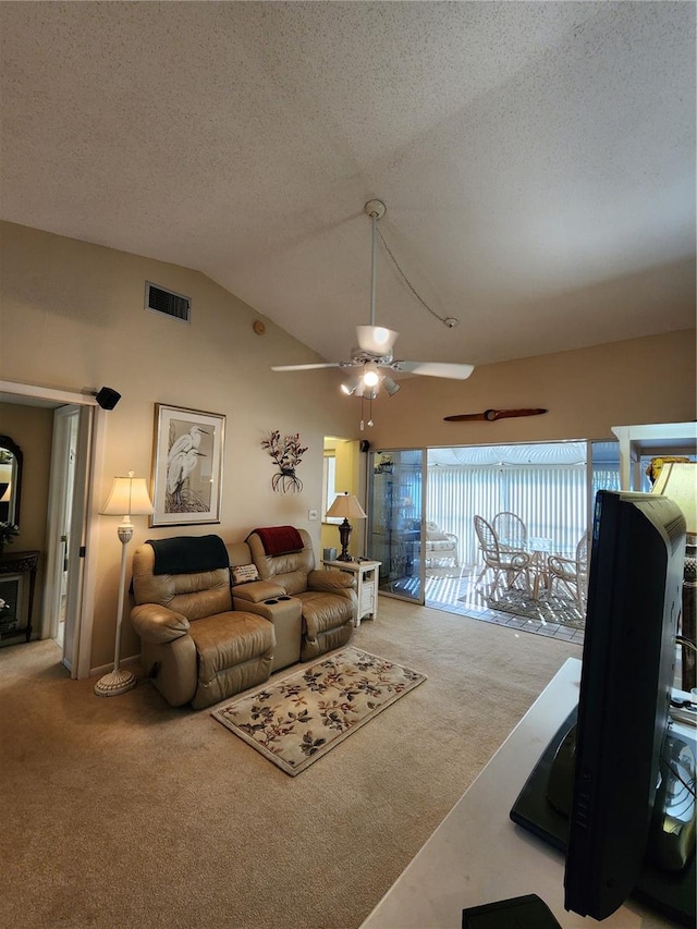 living room featuring ceiling fan, light colored carpet, a textured ceiling, and vaulted ceiling