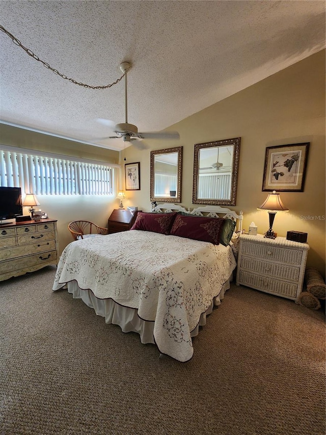 carpeted bedroom with ceiling fan, lofted ceiling, and a textured ceiling