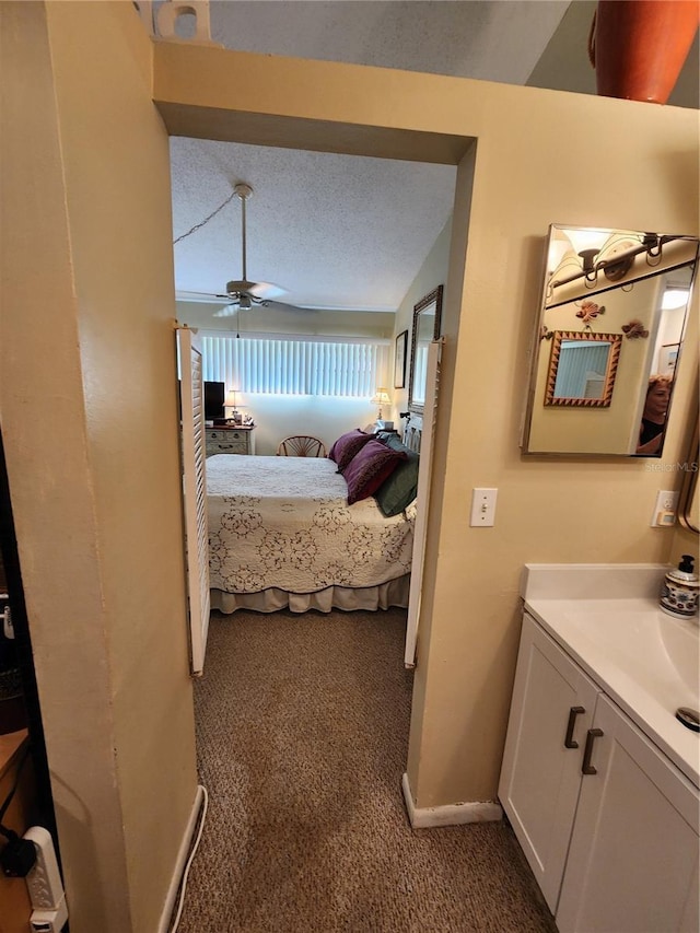 4632 Red Maple Rd Unit 1204, Bradenton, FL 34210 - bedroom with carpet floors, baseboards, ceiling fan, and a sink