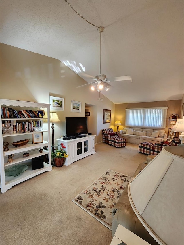 carpeted bedroom with a textured ceiling, ceiling fan, and lofted ceiling