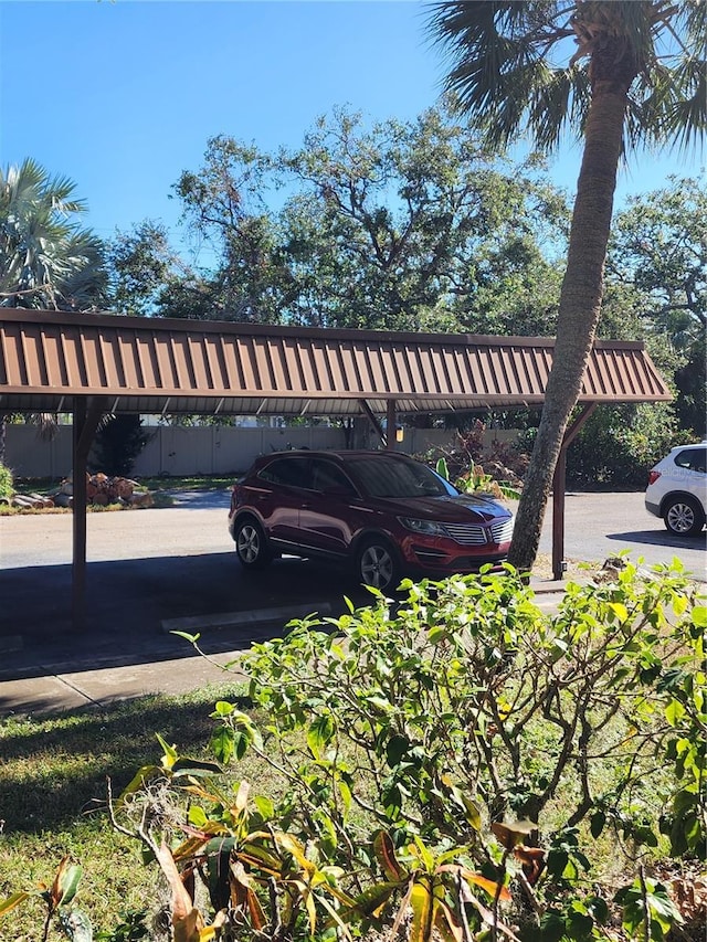 exterior space with a carport