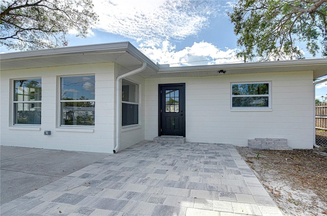 property entrance with a patio area