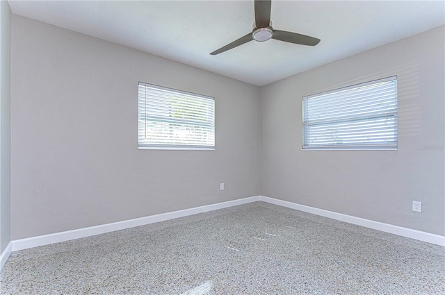 unfurnished room featuring ceiling fan