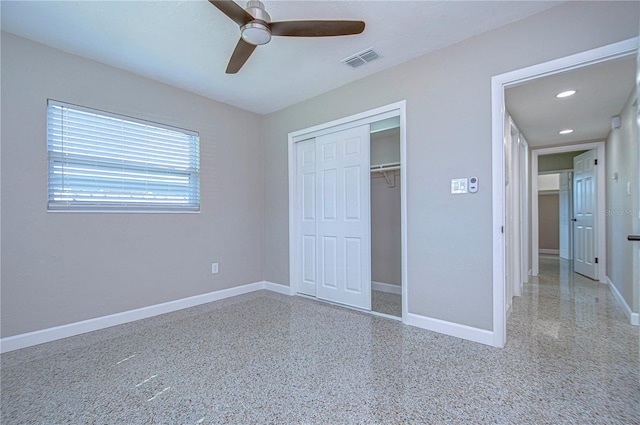 unfurnished bedroom featuring ceiling fan and a closet