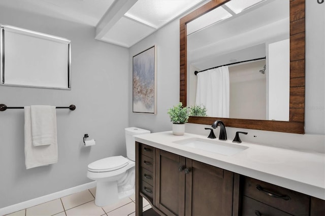 bathroom featuring toilet, tile patterned flooring, and vanity