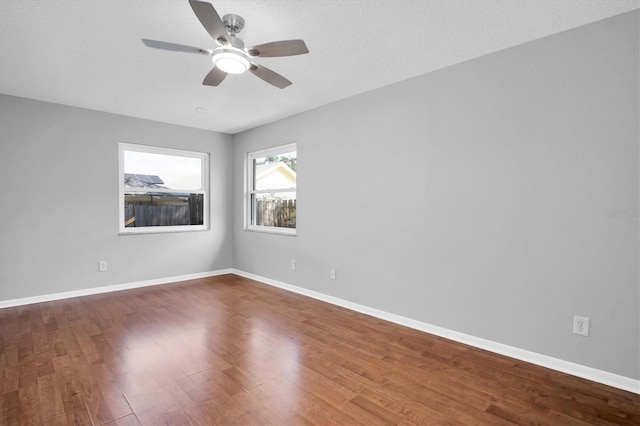 unfurnished room featuring a textured ceiling, ceiling fan, and hardwood / wood-style floors