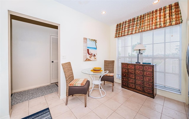 living area featuring tile patterned flooring