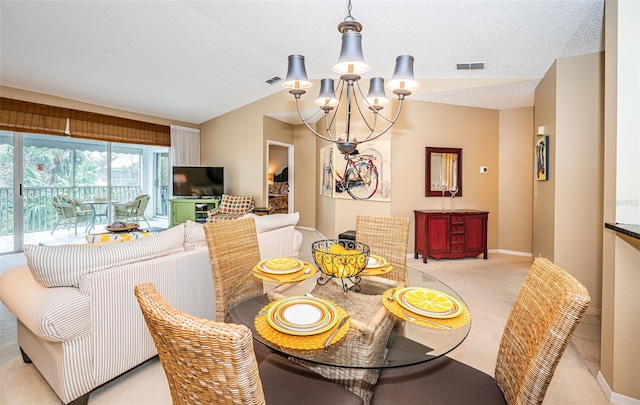 carpeted dining space with a textured ceiling, vaulted ceiling, and an inviting chandelier