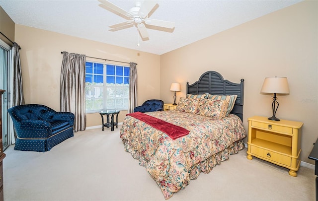 bedroom featuring carpet, a textured ceiling, and ceiling fan