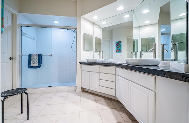 bathroom featuring vanity, tile patterned floors, and an enclosed shower