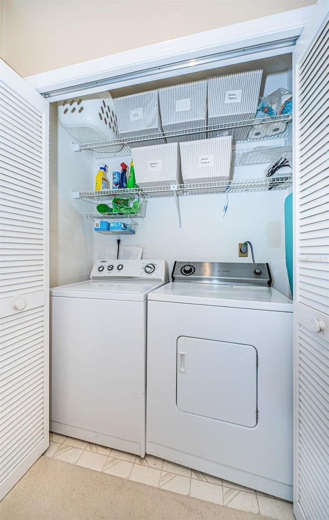 14880 Shipwatch Trce Unit 1915, Largo, FL 33774 - washroom featuring washing machine and clothes dryer
