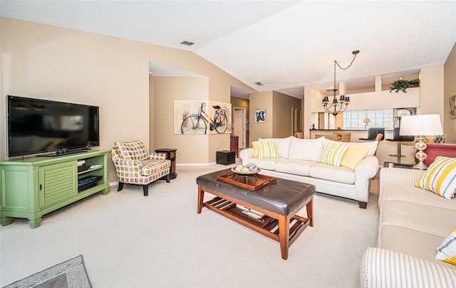 living room featuring light colored carpet, vaulted ceiling, and an inviting chandelier