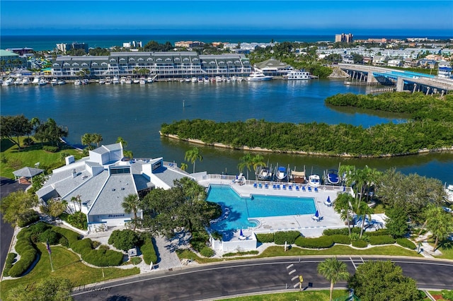 birds eye view of property with a water view