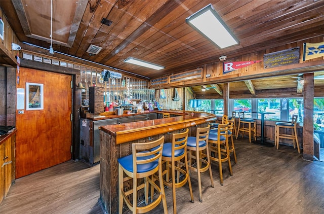 bar with hardwood / wood-style flooring and wooden ceiling