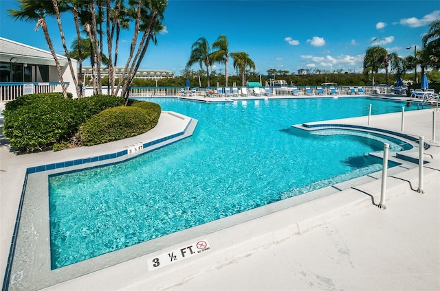 view of swimming pool with a patio