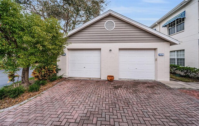 14880 Shipwatch Trce Unit 1915, Largo, FL 33774 - garage featuring decorative driveway