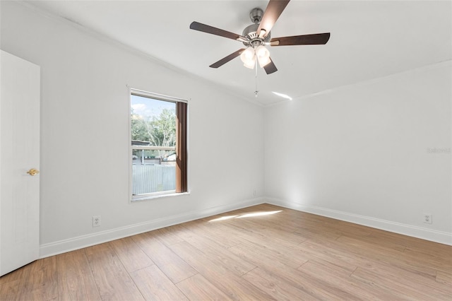 unfurnished room with ceiling fan, light hardwood / wood-style flooring, and ornamental molding