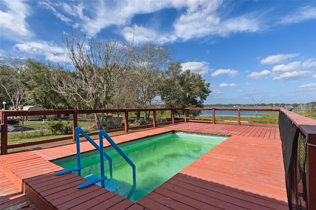 view of swimming pool featuring a deck with water view