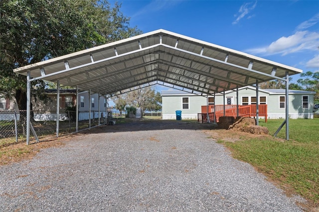 view of vehicle parking featuring a carport