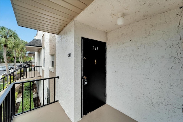 107 Caldwell Dr Unit 291, Brandon, FL 33510 - view of exterior entry featuring stucco siding