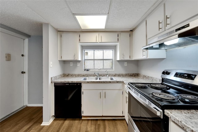 kitchen featuring stainless steel range with electric stovetop, sink, light hardwood / wood-style flooring, white cabinets, and black dishwasher