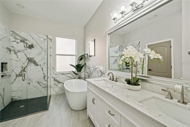 bathroom featuring vanity and shower with separate bathtub