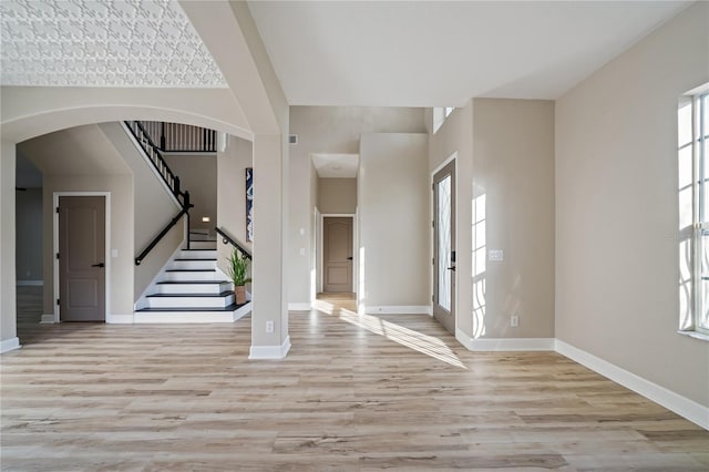 foyer featuring french doors and light hardwood / wood-style flooring