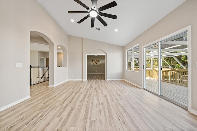 unfurnished living room featuring light hardwood / wood-style floors, high vaulted ceiling, and ceiling fan