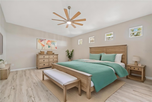 bedroom featuring light hardwood / wood-style floors and ceiling fan