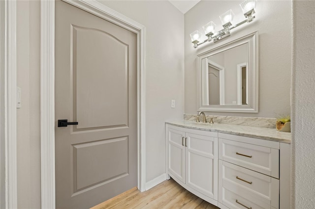 bathroom featuring vanity and wood-type flooring