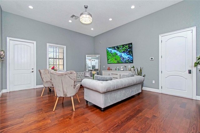 living room featuring dark wood-type flooring