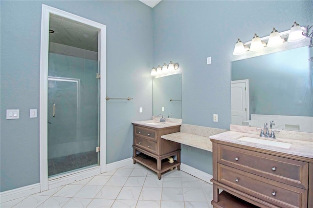 bathroom featuring vanity and an enclosed shower