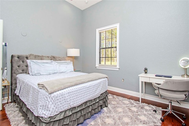 bedroom with hardwood / wood-style floors