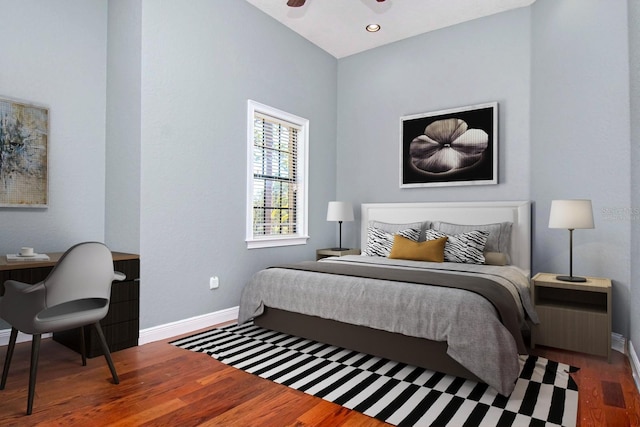 bedroom with ceiling fan and dark hardwood / wood-style floors