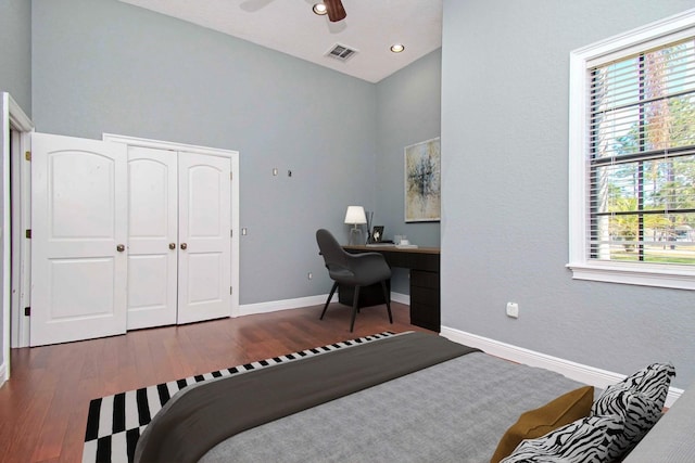 bedroom featuring a closet, hardwood / wood-style flooring, and ceiling fan