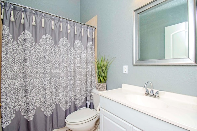 full bathroom featuring vanity, toilet, and shower / bathtub combination with curtain