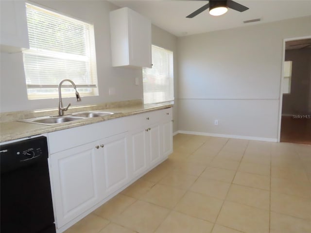 kitchen featuring black dishwasher, white cabinetry, plenty of natural light, and sink