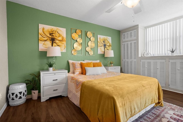 bedroom featuring ceiling fan and dark wood-type flooring