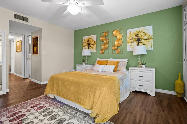 bedroom featuring ceiling fan and dark wood-type flooring