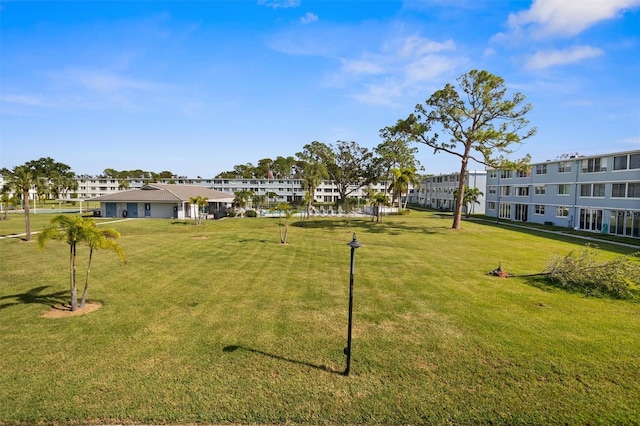 view of home's community featuring a yard