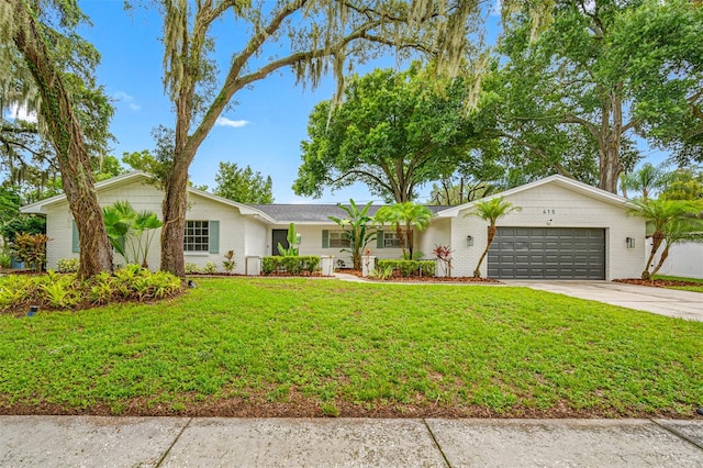 single story home with a garage and a front lawn