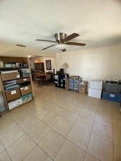 8906 Windsong Ln, Port Richey, FL 34668 - tiled living area with a ceiling fan